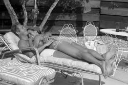 electricstateco: Steve McQueen and his wife Neile Adams lounge on the patio by the pool at their Palm Springs bungalow, 1963. 