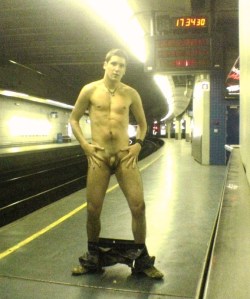Displaying his naked body on a subway platform&hellip;his hands seem to indicate that he is particularly into showing his cock and balls.