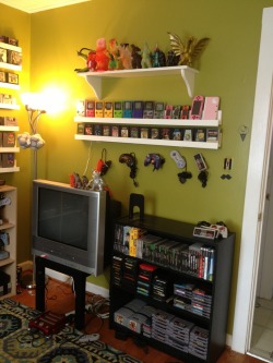 animeinagalaxyfaraway:  gamerpassion:  redfromvoid:  My room for old ass games. I built the arcade cabinet and the white shelves. I completed the shelves last night took a step back, admired my work… Then said in my head “you’re a 26 year old lady.”