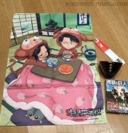 @drinkyourfuckingmilk @momtaku look what arrived for me today - Comiket 89 exclusive merchandise (Originally seen here)!I put SnK manga volume 18 in the picture for size reference - the Levi and Hanji fabric poster was a lot bigger than I anticipated!