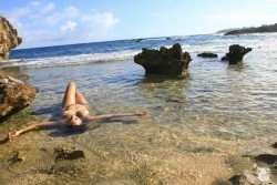 wwombb:  This was a such a precious moment that happened, it gives me goose bumps when I see it. I was showing my sea*star (who took this photo) one of the most amazing places on the island and we relaxed in this warm, shallow pool outstretched. And the