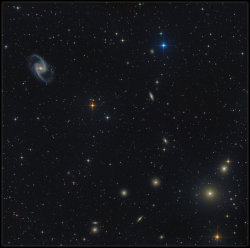 kenobi-wan-obi:   Fornax Galaxy Cluster &amp; NGC 1365  NGC 1365, also known as the Great Barred Spiral Galaxy, is a barred spiral galaxy about 56 million light-years away in the constellation Fornax. The spiral arms extend in a wide curve north and south