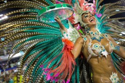 Celebration (Maria Caren Paz, from the Mangueira samba school, parades during carnival celebrations at the Sambadrome in Rio de Janeiro)