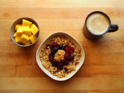 garden-of-vegan:  mango, oatmeal with cinnamon, agave syrup, ground flax seed, and soy milk topped with mixed berries, granola, and peanut butter, coffee with soy 