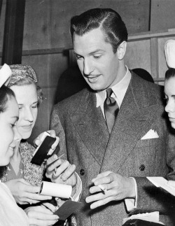 talentspast:   Vincent Price signs autographs for a group of female admirers  on the set of Service de Luxe, c. 1938 