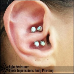 modificationnotmutilation:  mod-army:  One of the most unique and rare piercings that I have been lucky enough to perform. A healed double Conchal Crus piercing.  Performed with two 16g Industrial Strength curved bars with white prongset opals.  Badass