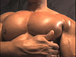 biggtoppdadd:  Just a light flick of the thumb and his entire body reacts.  Those are some fine looking pecs, son.  Mighty fine!