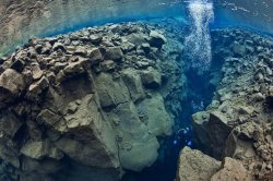 scienceisbeauty:  Located in the Þingvallavatn Lake in the Þingvellir National Park in Iceland, Silfra is crevice between the North American and Eurasian plates. Source: Tectonic Boundary Between the North American and Eurasian Plates (Travelycia)