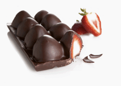 e-d-i-b-l-e:  Fruity chocolate bars by Jean-Charles Rochoux. This is a cute idea! Get a ice-cube tray (preferably circular) Put a little melted chocolate in the bottom of each mould  Drop in a strawberry (or your favourite fresh fruit) Cover the fruit