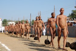 Maleinstructor:  Indian Holy Men. Digambara Parade  Elamite Mule Slaves Lead To The