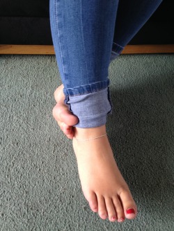 sweetfeet84:  My gorgeous 20 year old wife’s feet! I am a huge foot fetishist!   She needs help re applying her nail polish. Very cute feet though. Look nice and soft. 😉