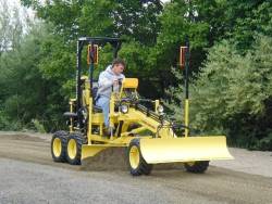 rollerman1:Compact grader with a laser level