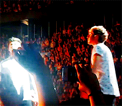 kryptoniall-deactivated20150613:  niall pointing to the person who sent the twitter question and zayn laughing because the person’s twitter name had “ziall&quot; in it. (link) 