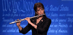 ffey:  GOD BLESS I FOUND THIS GIF OF TINA PLAYING THE FLUTE AND SHE ACTUALLY HELD IT RIGHT AND MADE MUSIC she played flute in high school  I AM JUST SO HAPPY BECAUSE OF THIS 