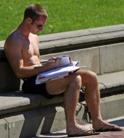 shorts-and-underwear:  Reading shirtless in shorts in a sunny public park
