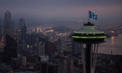 uofwa:  Seattle Saturday, we love our city! The Space Needle is proudly flying a Seahawks flag high above the city this weekend! Go Huskies, Go Hawks, Go Seattle! Thanks to our friends at the Space Needle for this wonderful photo!  Love my city!!!!