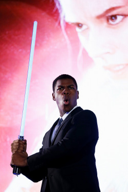 soph-okonedo:    John Boyega poses with a lightsaber at the ‘Star Wars: The Force Awakens’ fan event at the Roppongi Hills on December 10, 2015 in Tokyo, Japan   