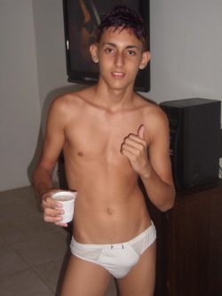 coolbrandonanthonythings:Smooth tan hot slender body, just hanging out in his thin undies for now.  Large penis bulging and lying to one side inside.  Cute sexy ears and short mussy hair; probably just woke up.
