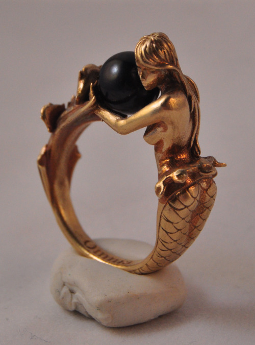 omniastudios:  “Arianna” art deco inspired mermaid ring. Available in brass and sterling silver. Arianna holds an 8mm black or white pearl. Now available for purchase. www.omniaoddities.com 