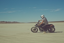 overlandjournal:  Riley Harper takes The Mighty Motor’s Triumph Scrambler for a whip in the Mojave Desert.  Photo: Sinuhe Xavier