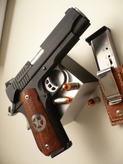 gunsknivesgear:  How to Choose A Defensive Handgun, Part VII: The Way of the Gun Above is a Sig Sauer 1911, one of the best production .45 caliber pistols. The 1911 is a sleek, classic weapon much loved by people who appreciate time-tested designs. This