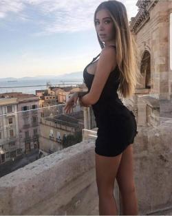 Short Black Dress on a balcony