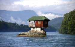 inothernews:  LITTLE HOUSE ON THE AERIE  A house, built in 1968, rests upon on a rock on the river Drina in western Serbia.  (Photo: Marko Djurica / Reuters via The Telegraph)