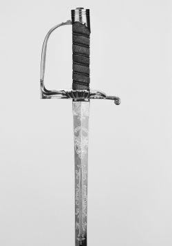 art-of-swords:  Military Dress Sword Dated: circa 1787-91 Culture: English Medium and techniques: gilt brass, wood, fish skin, silver wire, gilt, blued steel/etched Measurements: overall length 95cm; blade length 62cm The sword has a gilt/brass hilt with