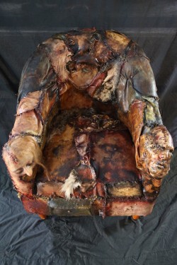 red-lipstick:  Custom Ed Gein Skin Chair designed by Kayla Arena at Slaughter FX and inspired by the American Murderer and Body Snatcher Ed Gein. It is made from  Latex human flesh and body parts. Ū,500.00.  There are also shoes, lamps and pocketbooks