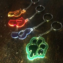 stripedhare:  Puppy Tags/Keychains Recently I was commissioned by @puppyprideuk​ to do some halloween keychain designs for them for the holiday season.They were turned into these very lovely laser cut acrylic charms, so if that is a thing that interests