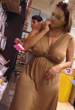 lactolicious:  I snapped this.  This chic’s big tits have to be filled with milk by the size of her nipples busting through her dress.  I think she needs to be milked.