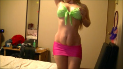 Christina Lazza rocking a neon bikini top and ultra mini