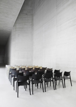 just-good-design:  This is San Telmo Museum in San Sebastian, with a layout of the four different colors of the STUA Laclasica chair. Severe architecture by Nieto Sobejano for a comfy chair by Jesús Gasca.
