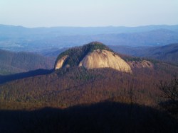 earthstory:  Looking Glass RockThis bald-sided peak is visible from the Blue Ridge Parkway, near Asheville North Carolina. The peak’s name, “Looking Glass Rock”, supposedly originates from the way the light reflects off the slopes, particularly