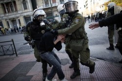 SURROUNDED: Police detained a protester in