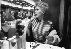 wehadfacesthen:  Kim Novak in the dining car of the Super Chief being ogled by male diners, 1956, LIFE magazine