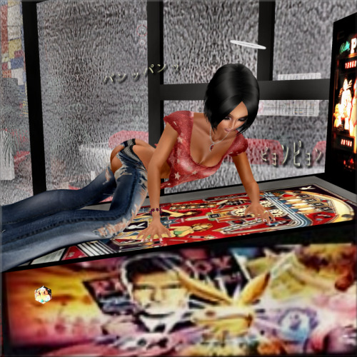 XXX Playing with the pinball machine at the REAL photo
