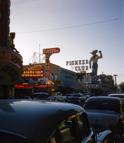 vintagelasvegas: Most of the lights off on Fremont Street c. 1954-1956 No story or date behind this photo, one half of a stereo slide from 3D Kodachrome extraordinaire Ah Pook. Nevada Club, Fortune Club, and the Western Union building were merged a couple