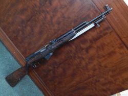 gunrunnerhell:  SKS An old, beat up, dirty Chinese SKS with trench art. It looks like someone carved “I ❤” but either didn’t finish it or it faded away/got rubbed off. This SKS looks just at home being a wall hanger over the fireplace as it