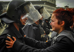  This girl was crying and begging the policeman not to hit her or any of her friends. Then the policeman started crying as well and he said to her: “You just hold on girl.” The photo comes from protests happening in Bulgaria right now. Students are