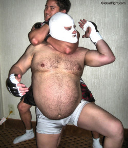 wrestlerswrestlingphotos:  beefy daddie huge pecs hairy man getting choked