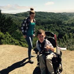 laughingatmynightmare:  laughingatmynightmare:  Hi Tumblr. My name is Shane Burcaw, and I’m the hipsterly-dressed dinosaur creature in the wheelchair above. The beautiful girl is my girlfriend Anna. We were climbing a mountain (in Tom’s and khakis,