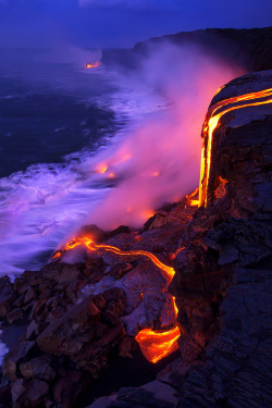 travelgurus:  Outstanding Photo of Lava cascadeing over a 30 foot cliff,creating new land at    its base, at the coast of   Hawaiʻi Volcanoes    National Park  by Bruce Omori                 Travel Gurus - Follow for more Nature Photographies!
