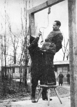 historicaltimes:  Rudolph Hoss, the Commandant of Auschwitz, trying to avoid the noose, before being hanged on the grounds of Auschwitz . via reddit