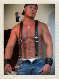 Those leather suspenders must feel really good when rubbing against his nipples.  For more gay nippleplay, visit Nipple Pigs