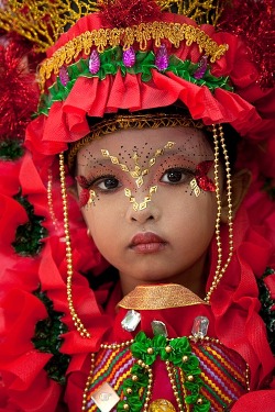 All dressed up and nowhere to go (a little girl participates in the Jember Fashion Carnival on East Java, Indonesia)