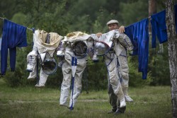 for-all-mankind:  glukauf:  An employe of Russian Space Training Center hangs out to dry space suits (Photo by Alexander Zemlianichenko/AP Photo)  Howdy neighbor. Just doing my laundry.
