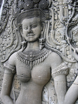 Sculpture of a topless Cambodian woman, by Aron Danburg. 
