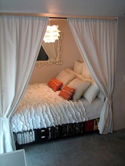 sweetestesthome:  Bed placed inside a closet- leaves the bedroom open for other furniture and creates a cozy little hideout to sleep in.