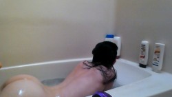 unicronkween:  In my tub. Pardon the hair